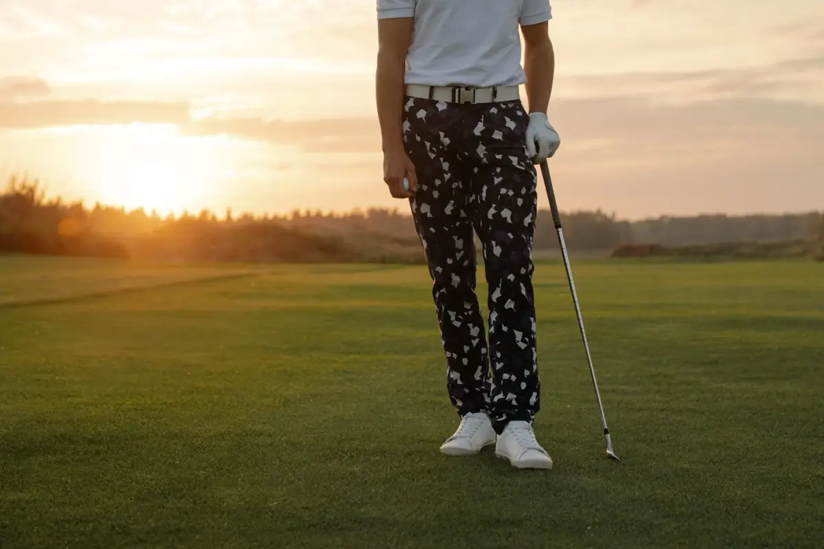 A member finishing the round at sunset